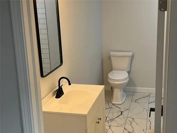 a bathroom with a sink and a toilet