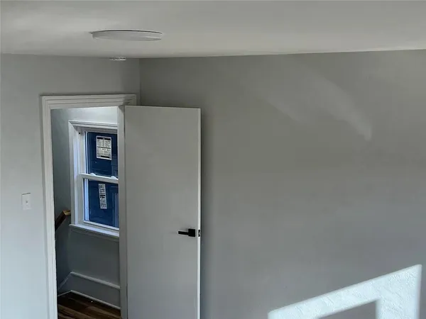 a view of an empty room and cabinet