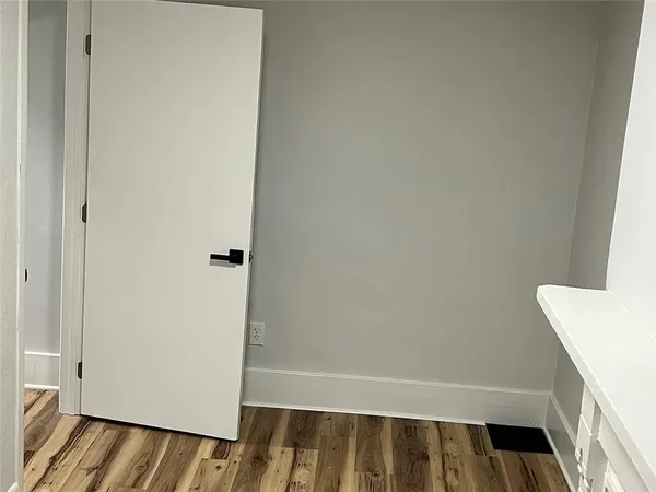 a view of wooden floor in a kitchen