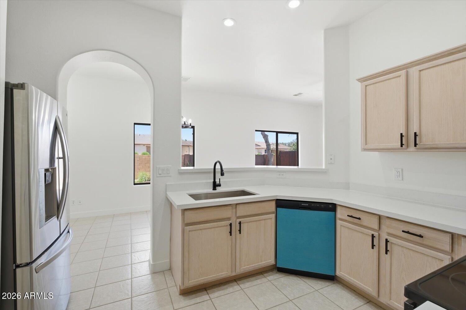 2565 South Signal Butte Road, Unit 23 Mesa, AZ 85209 - Photo 11 of 29 a kitchen with a sink and cabinets