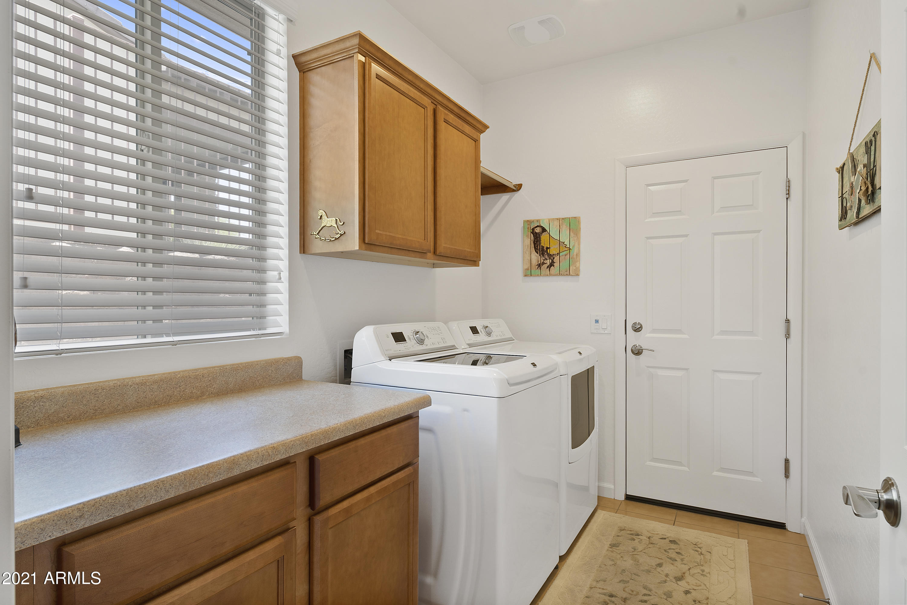 3301 Rising Sun Ridge Wickenburg, AZ 85390 - Photo 20 of 34 Indoor laundry with storage