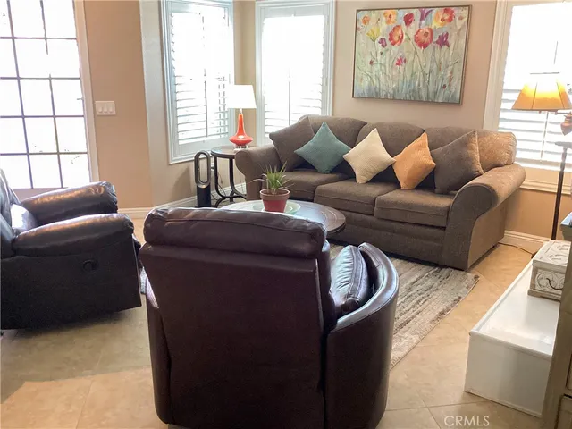 a living room with furniture with wooden floor