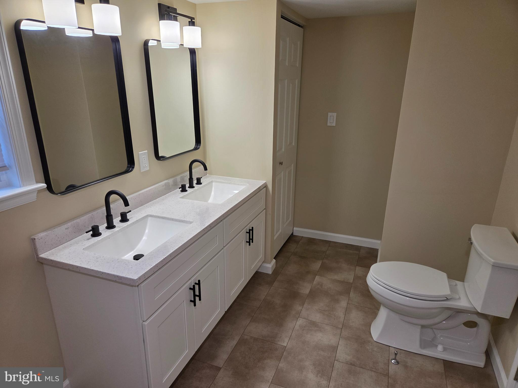 450 Ford Hook Road Doylestown, PA 18901 - Photo 16 of 21 a bathroom with double vanity sink and mirror