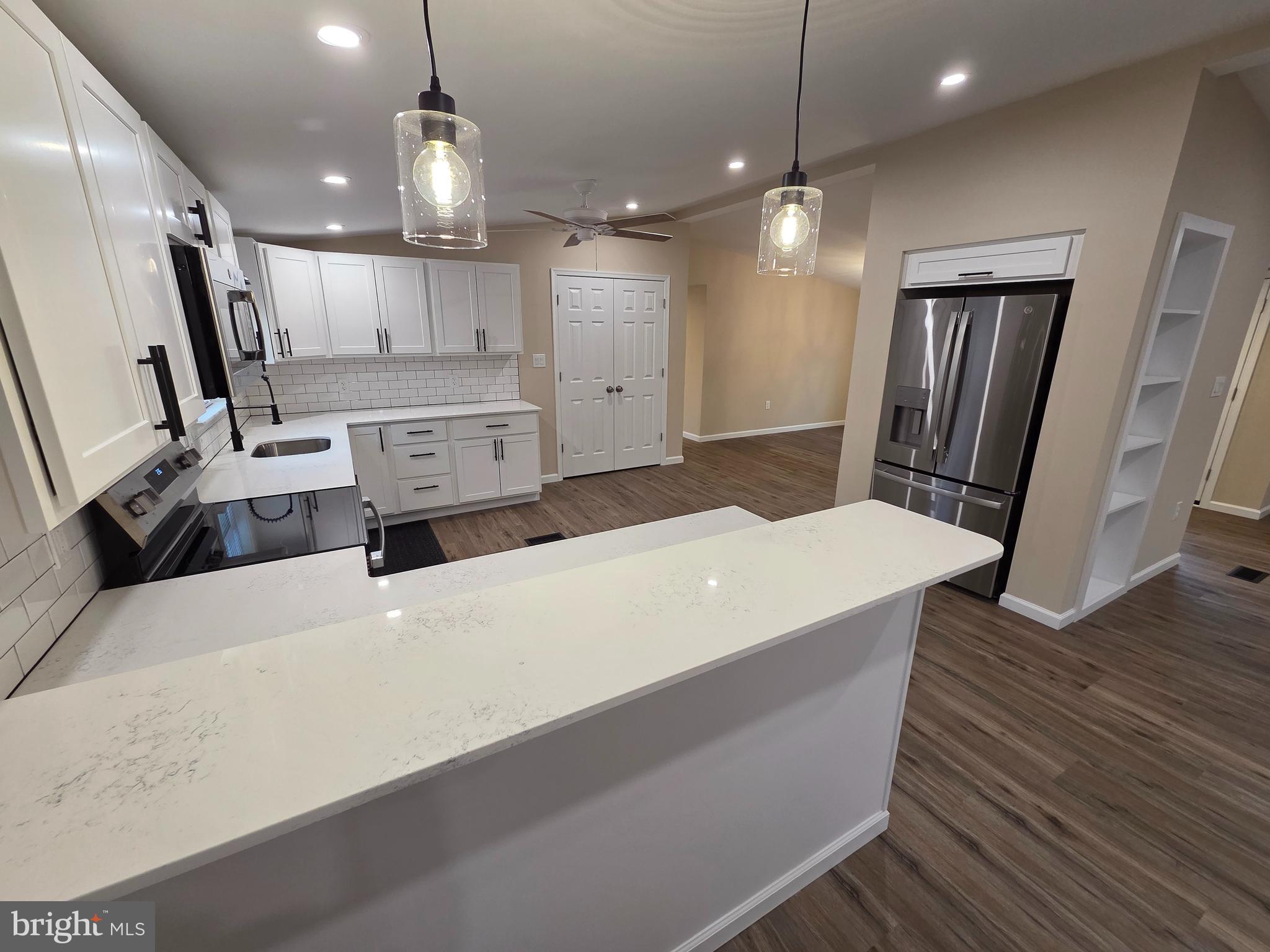 450 Ford Hook Road Doylestown, PA 18901 - Photo 8 of 21 a large room with wooden floor and windows