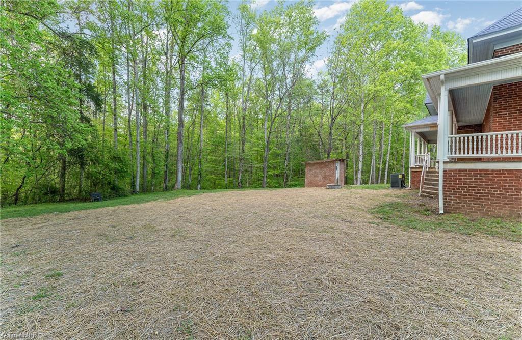 6851 Siloam Road Siloam, NC 27047 - Photo 21 of 25 Backyard. NO restrictions on acreage.