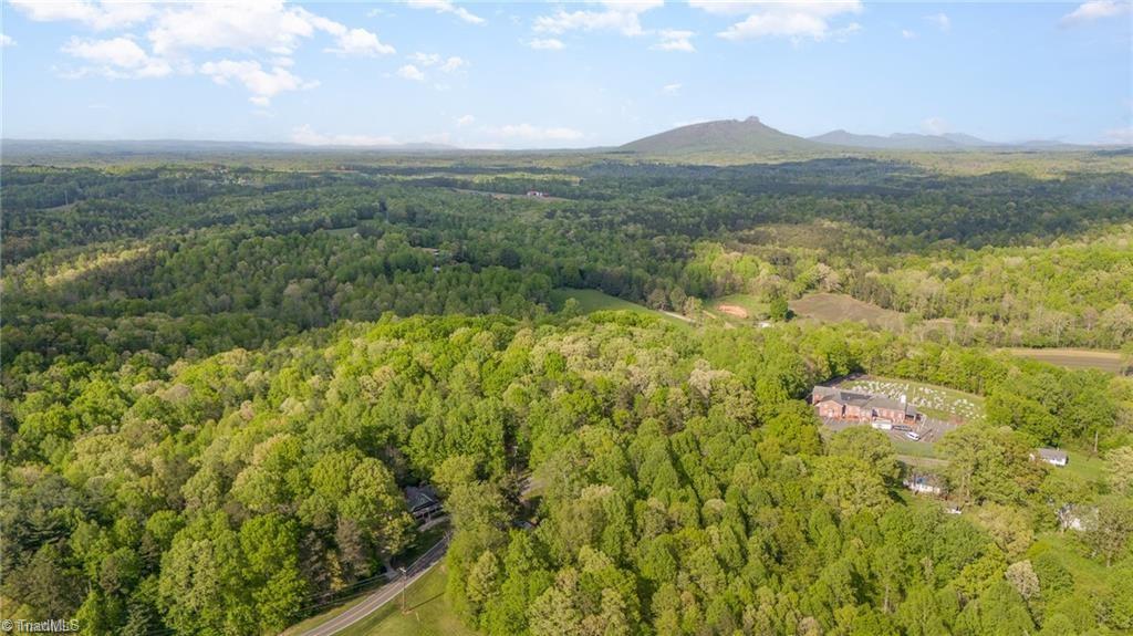 6851 Siloam Road Siloam, NC 27047 - Photo 23 of 25 Drone view with Pilot Mountain. Pilot Mountain is approx. 16 miles from the home.