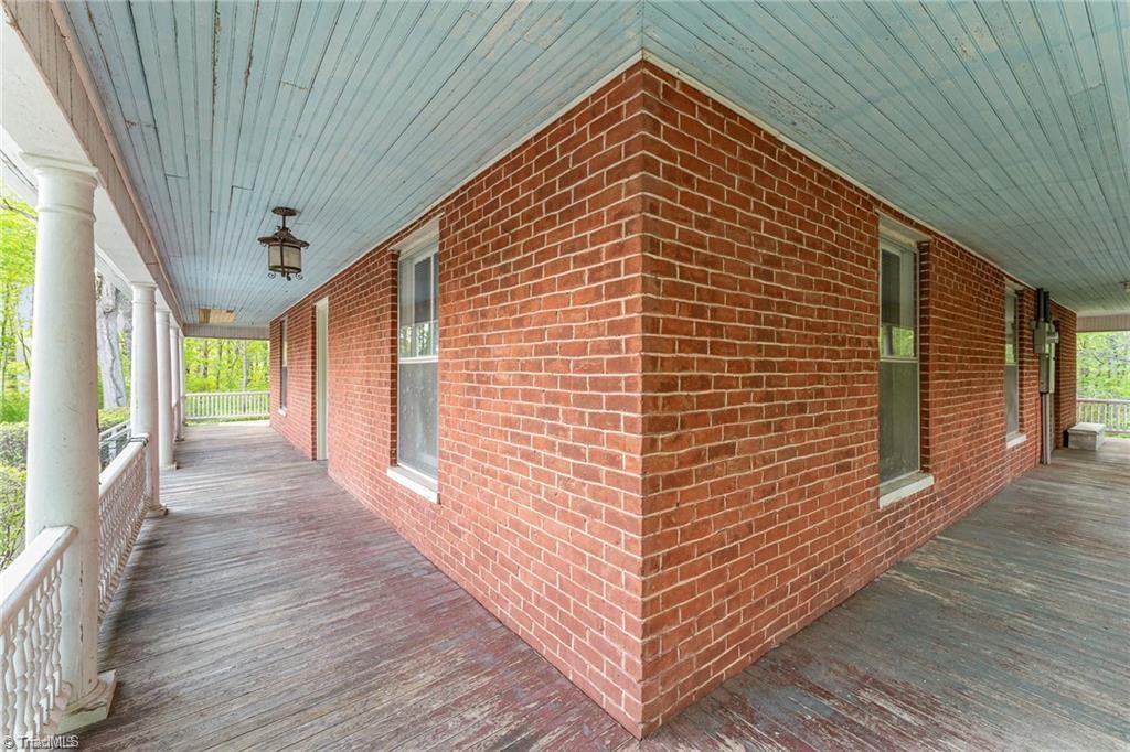 6851 Siloam Road Siloam, NC 27047 - Photo 6 of 25 Full wraparound porch.