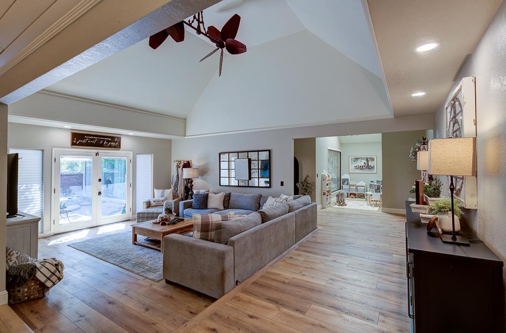 2555 West Bluff Avenue, Unit 152 Fresno, CA 93711 - Photo 1 of 45 a living room with furniture and a wooden floor