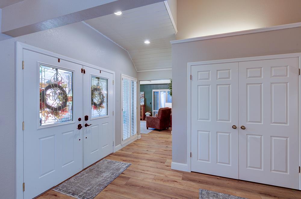 2555 West Bluff Avenue, Unit 152 Fresno, CA 93711 - Photo 11 of 45 a view of a hallway with wooden floor and closet area