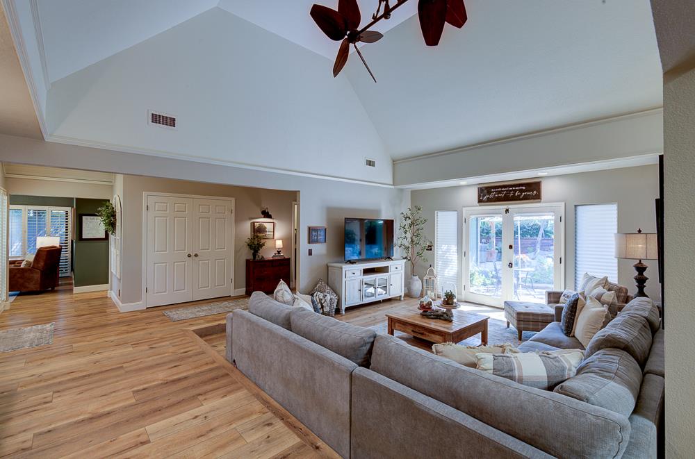 2555 West Bluff Avenue, Unit 152 Fresno, CA 93711 - Photo 13 of 45 a living room with furniture and a wooden floor