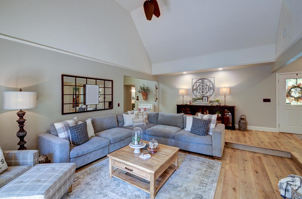 2555 West Bluff Avenue, Unit 152 Fresno, CA 93711 - Photo 14 of 45 a living room with furniture and a wooden floor