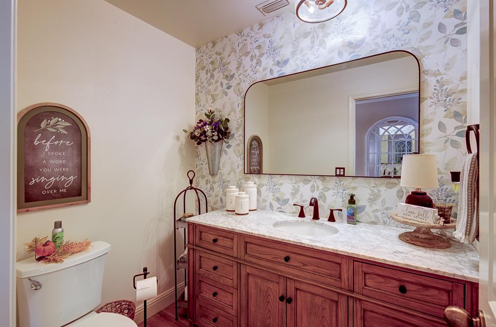 2555 West Bluff Avenue, Unit 152 Fresno, CA 93711 - Photo 19 of 45 a bathroom with a sink and a mirror