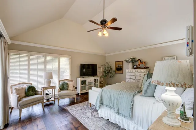 a bedroom with a bed and a couch