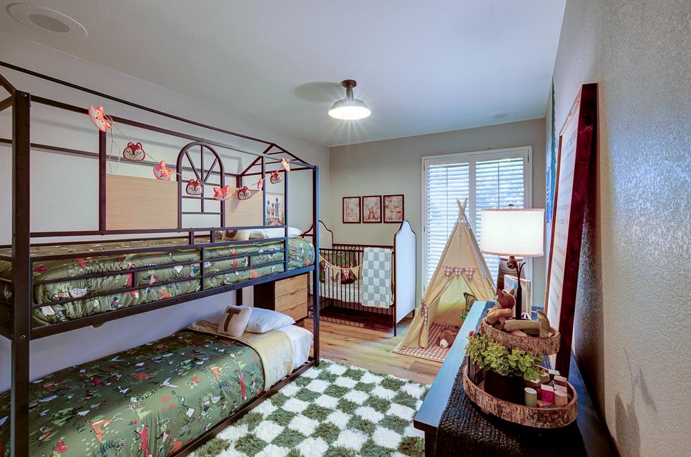 2555 West Bluff Avenue, Unit 152 Fresno, CA 93711 - Photo 28 of 45 a bedroom with furniture and a large window