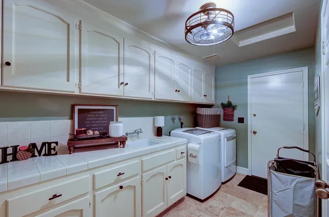 a kitchen with a sink and cabinets