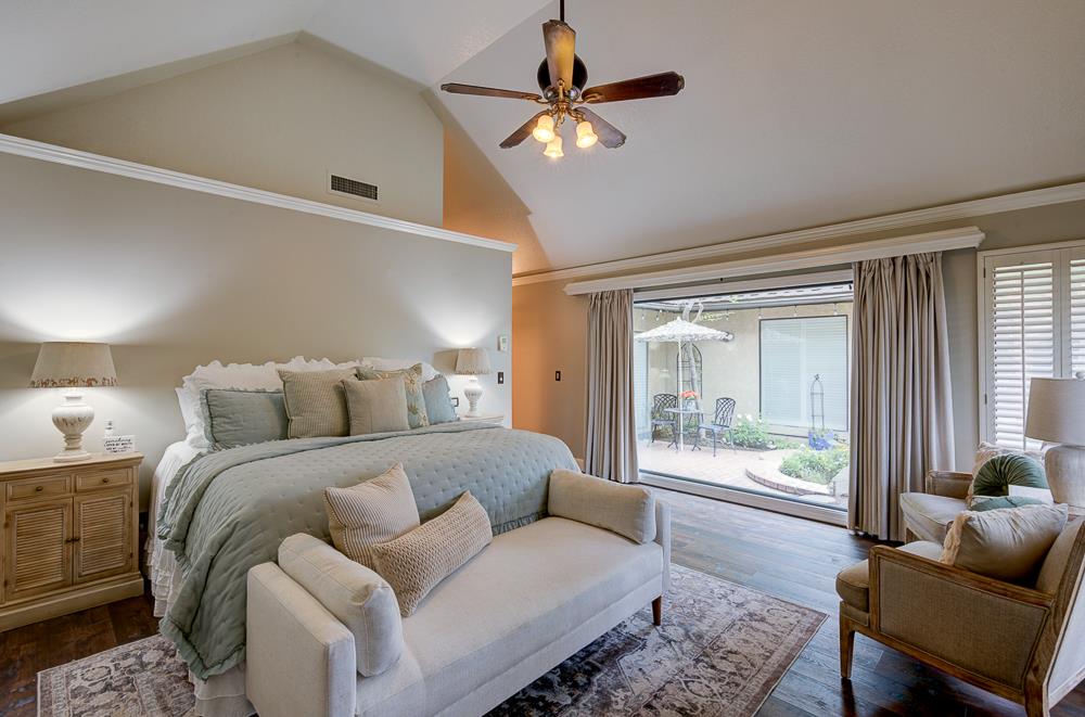 2555 West Bluff Avenue, Unit 152 Fresno, CA 93711 - Photo 6 of 45 a bed room with a bed and a large window