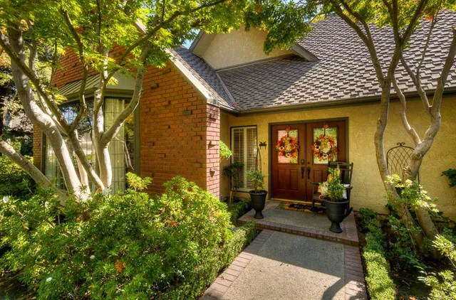 a front view of a house having yard