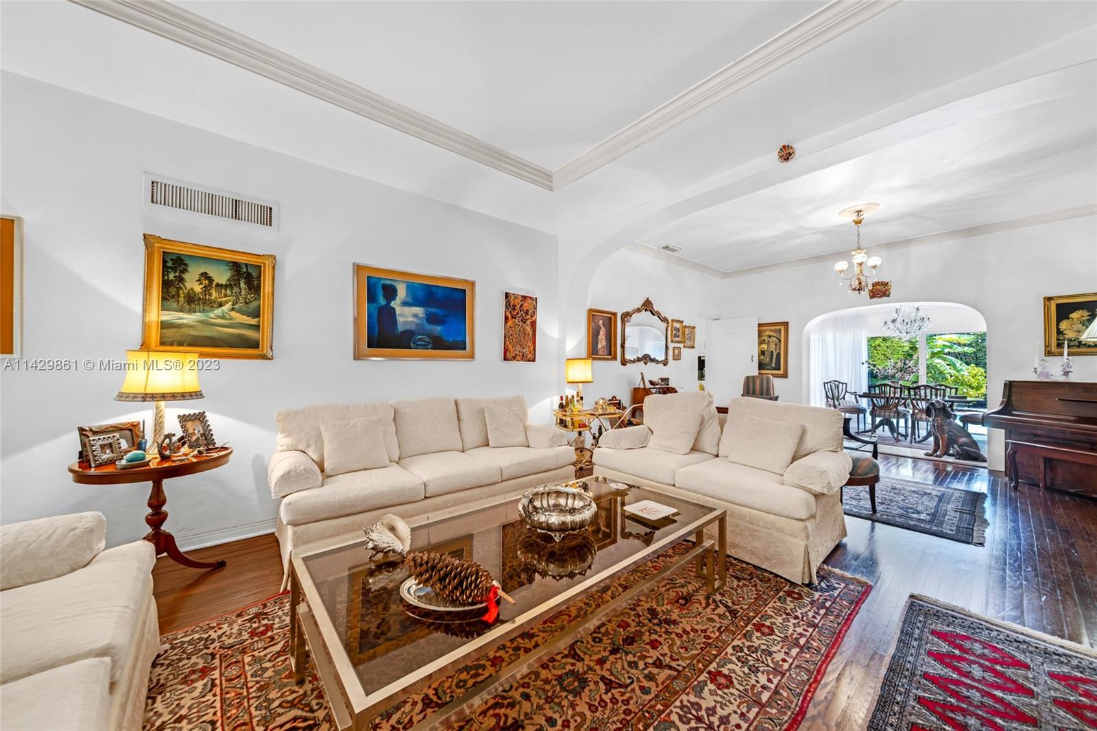 2935 North Bay Road Miami Beach, FL 33140 - Photo 12 of 27 a living room with furniture and a rug