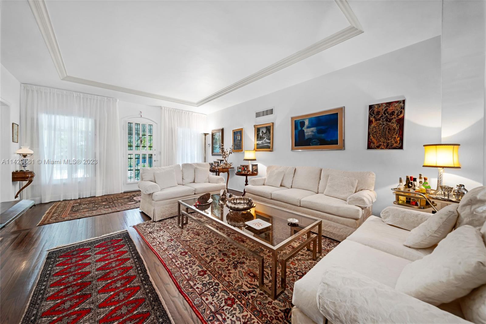 2935 North Bay Road Miami Beach, FL 33140 - Photo 13 of 27 a living room with furniture and a rug