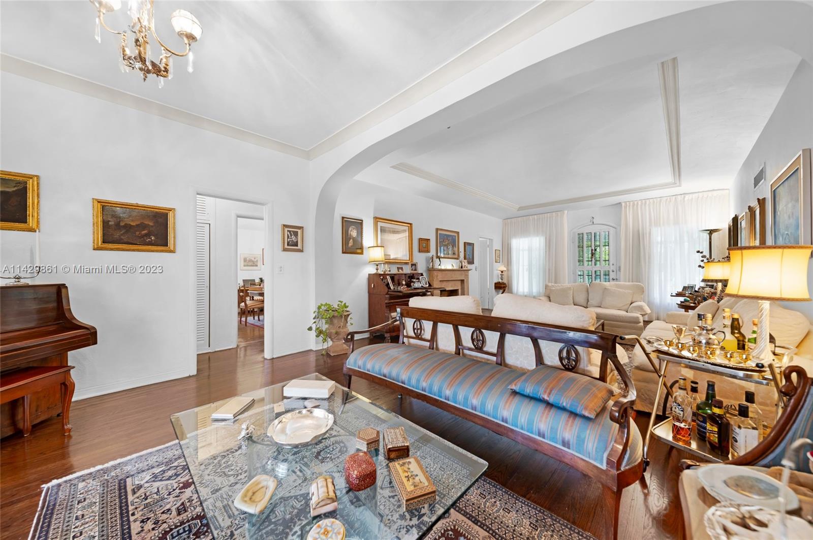 2935 North Bay Road Miami Beach, FL 33140 - Photo 15 of 27 a living room with furniture and wooden floor