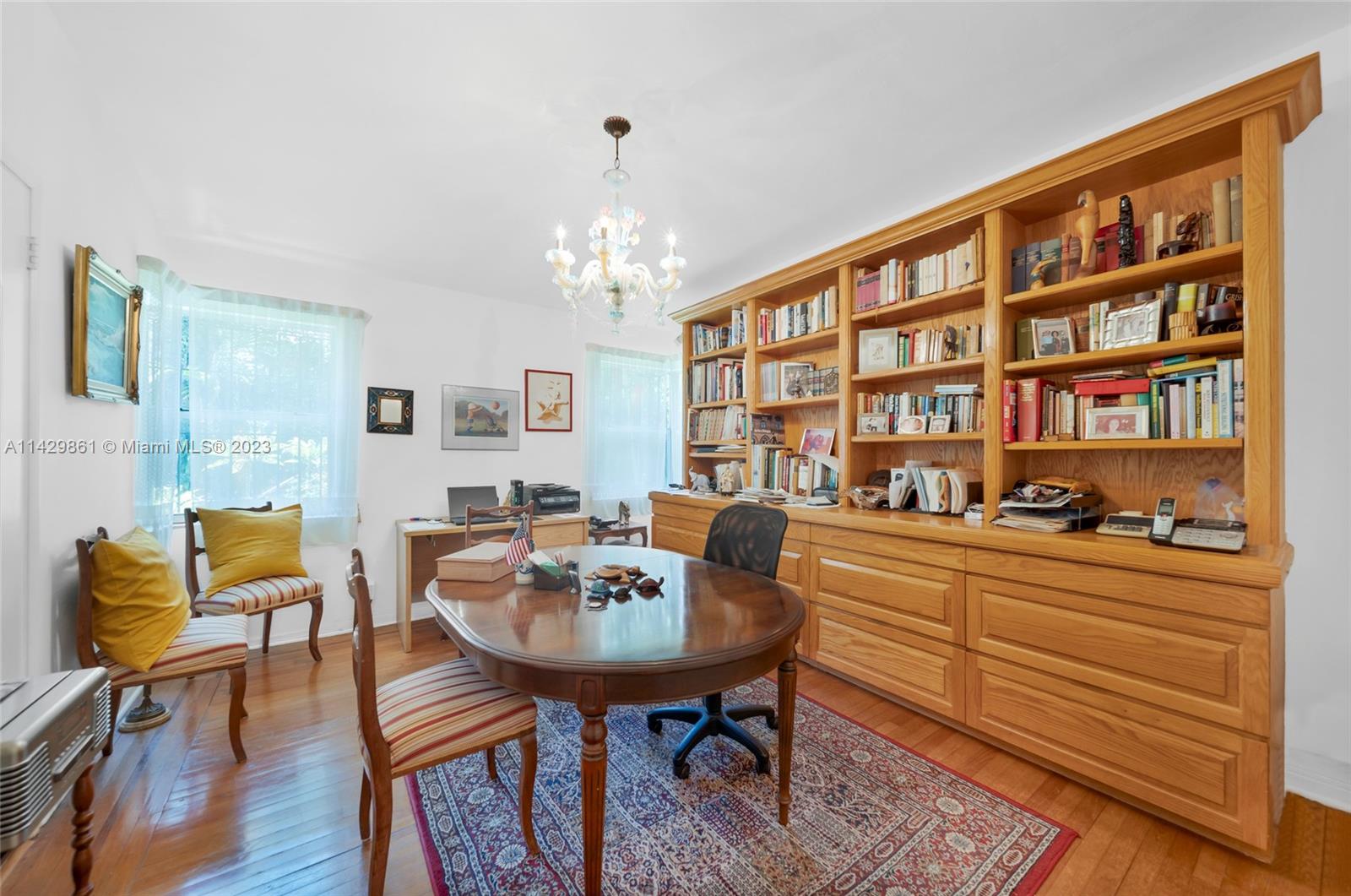 2935 North Bay Road Miami Beach, FL 33140 - Photo 23 of 27 a view of a dining room with furniture and chandelier