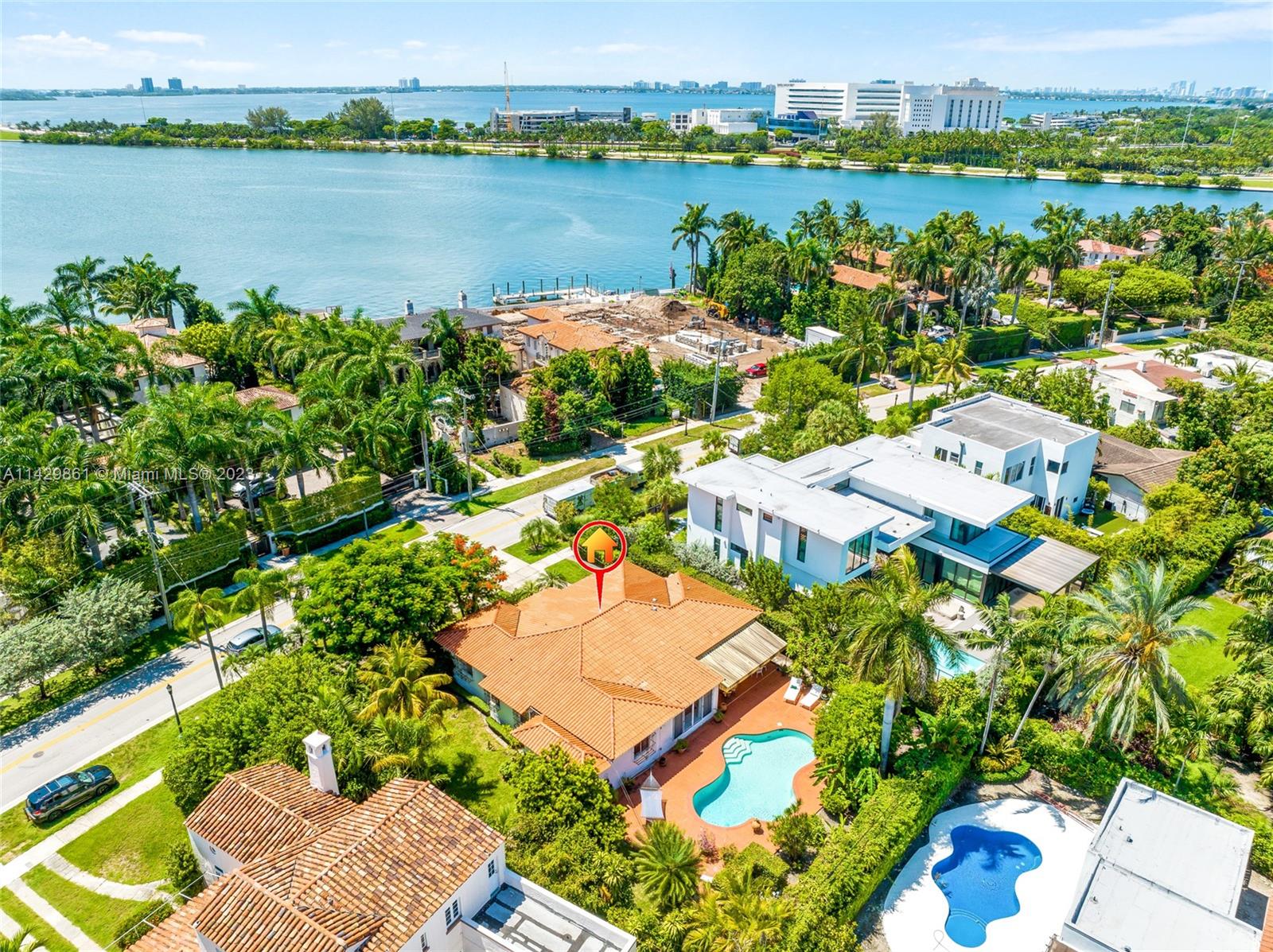 2935 North Bay Road Miami Beach, FL 33140 - Photo 9 of 27 an aerial view of a houses with a lake view
