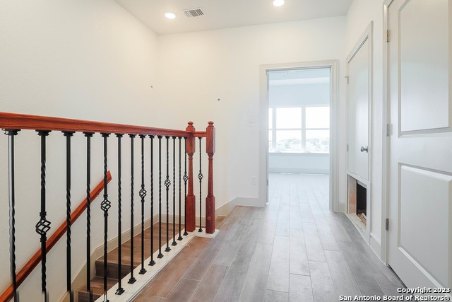 289 Star Grass, Unit B Spring Branch, TX 78070 - Photo 13 of 15 a view of hallway with wooden floor