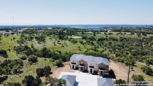 289 Star Grass, Unit B Spring Branch, TX 78070 - Photo 14 of 15 an aerial view of a house with a yard