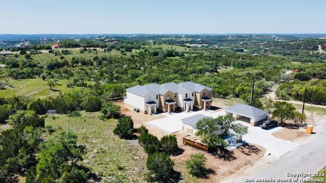 an aerial view of a house with a garden