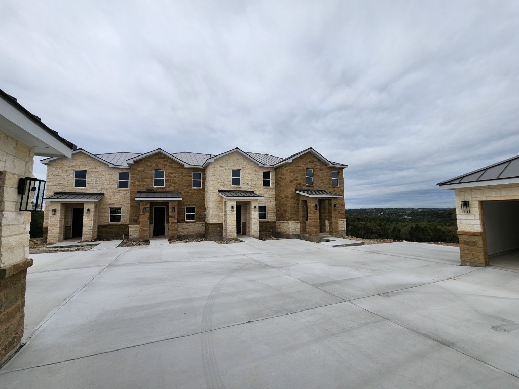 289 Star Grass, Unit B Spring Branch, TX 78070 - Photo 6 of 15 a view of house with yard in front of it