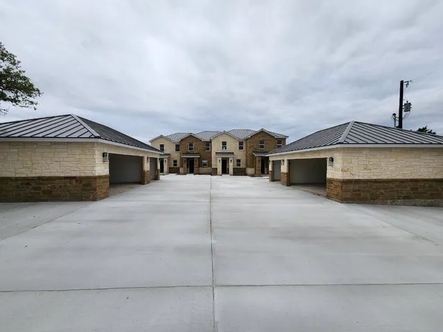 a front view of a house with a garage