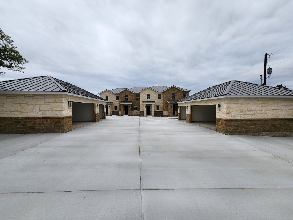 289 Star Grass, Unit B Spring Branch, TX 78070 - Photo 7 of 15 a front view of a house with a garage