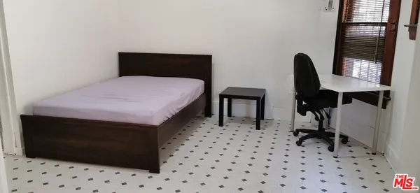 a bathroom with a shower and a toilet