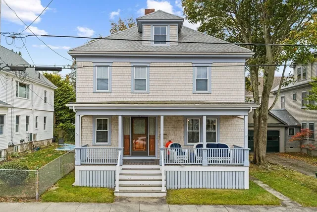 a view of a house with a yard and couches chairs