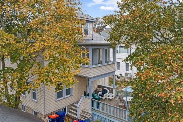 a kitchen with stainless steel appliances granite countertop a stove refrigerator a sink a microwave and island