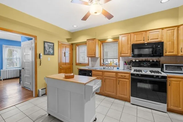 a kitchen with stainless steel appliances cabinets and a counter top space