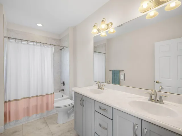 a kitchen with a stove and white cabinets