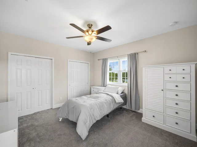 a kitchen view with stainless steel appliances kitchen island granite countertop a stove and a sink