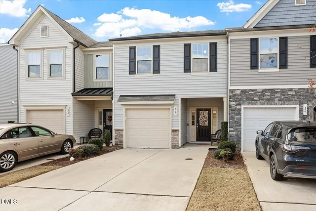 a view of a car parked in front of a house