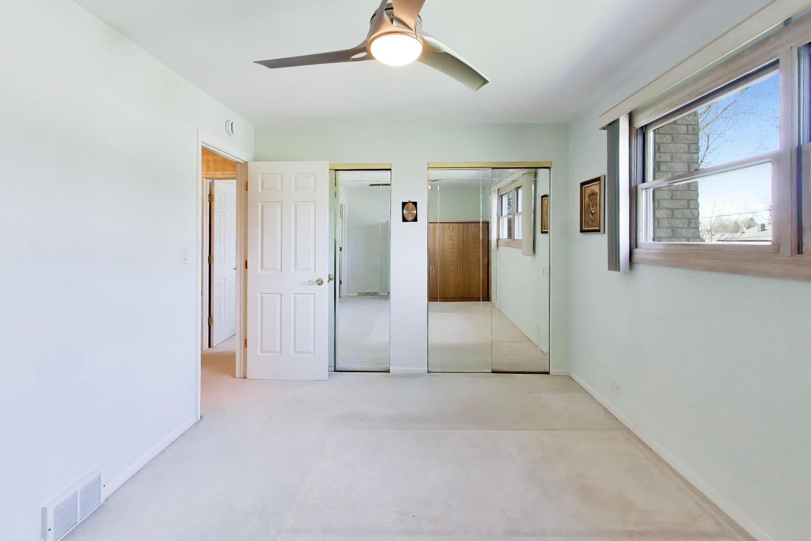 634 West Millers Road Des Plaines, IL 60016 - Photo 13 of 42 a view of a livingroom with a ceiling fan and window