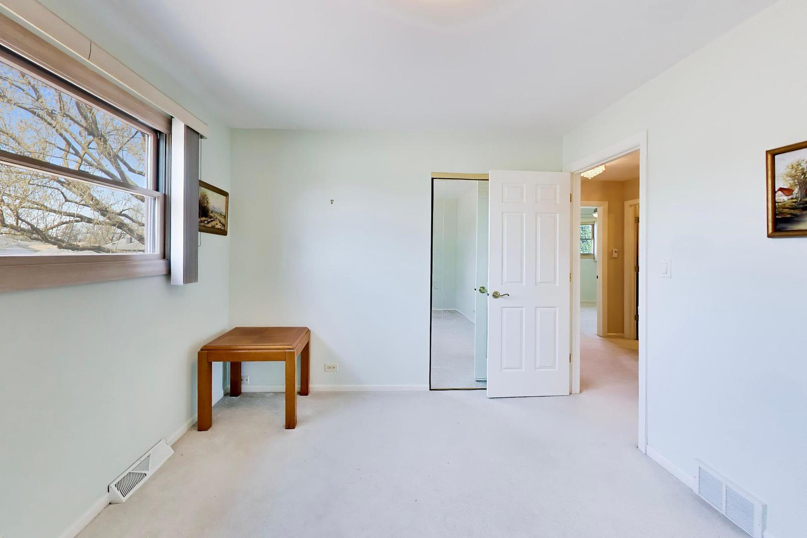 634 West Millers Road Des Plaines, IL 60016 - Photo 20 of 42 a view of an empty room with window and a kitchen
