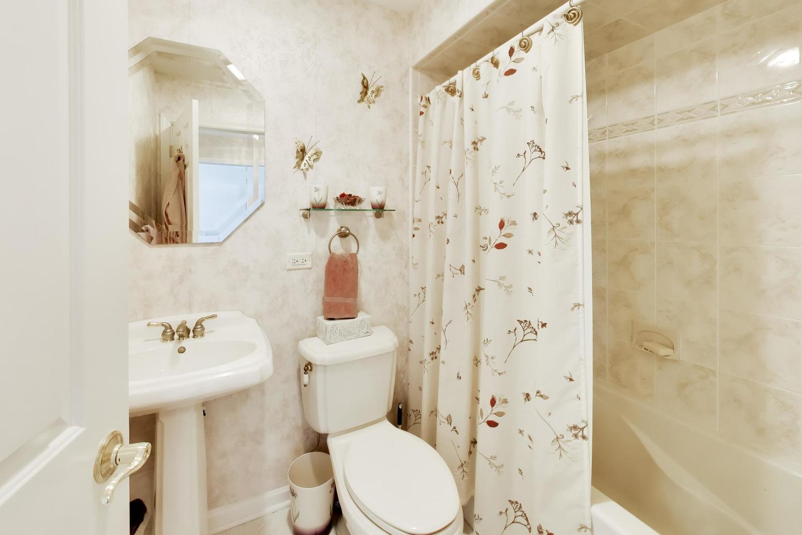 634 West Millers Road Des Plaines, IL 60016 - Photo 21 of 42 a white toilet sitting next to a bathroom sink