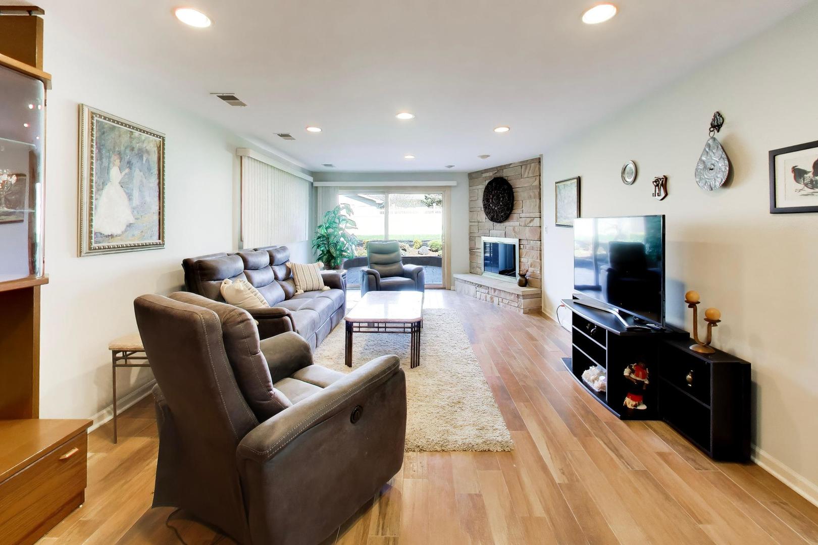 634 West Millers Road Des Plaines, IL 60016 - Photo 23 of 42 a living room with furniture and a flat screen tv