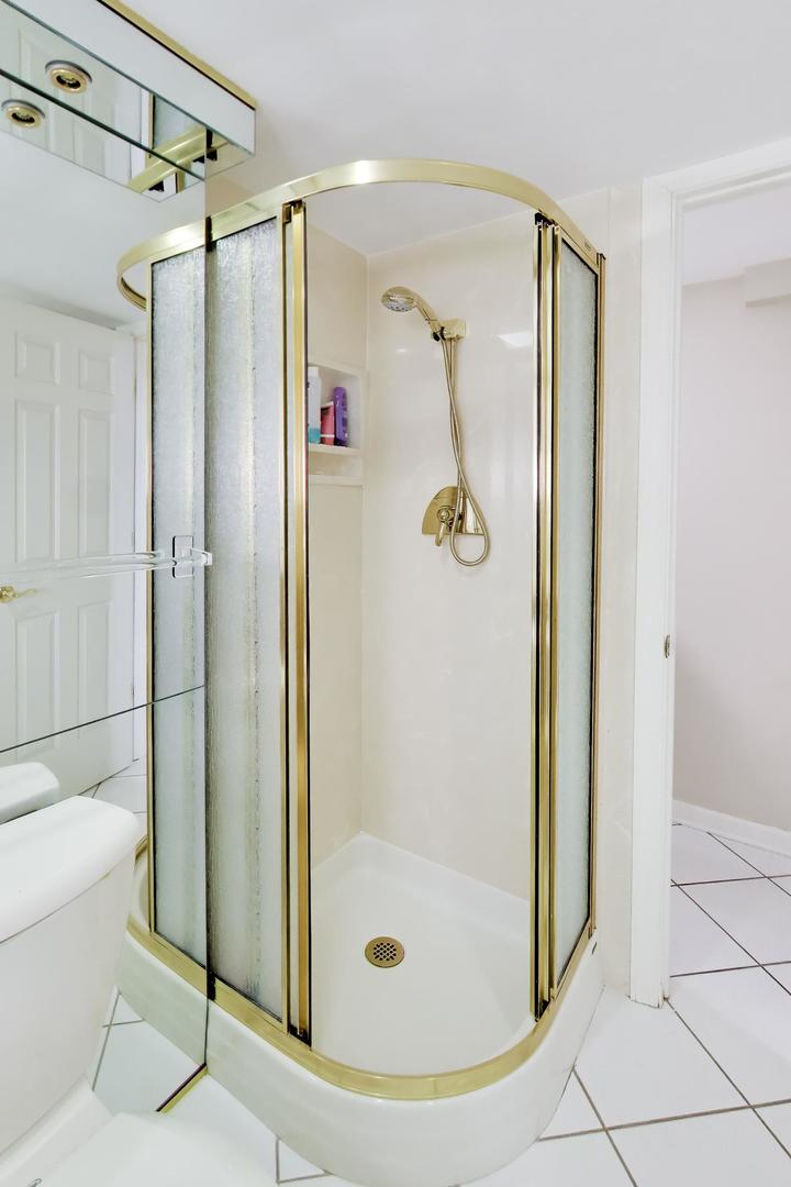 634 West Millers Road Des Plaines, IL 60016 - Photo 28 of 42 a bathroom with a glass shower door