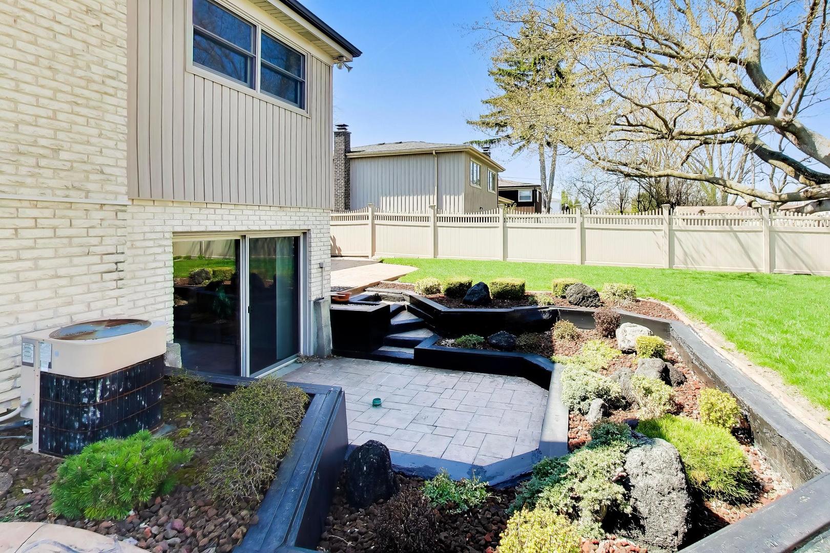 634 West Millers Road Des Plaines, IL 60016 - Photo 35 of 42 a view of a backyard with sitting area and garden