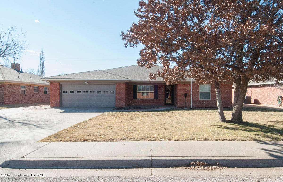 7203 Dreyfuss Road Amarillo, TX 79106 - Photo 1 of 22 a front view of a house with a yard covered with snow