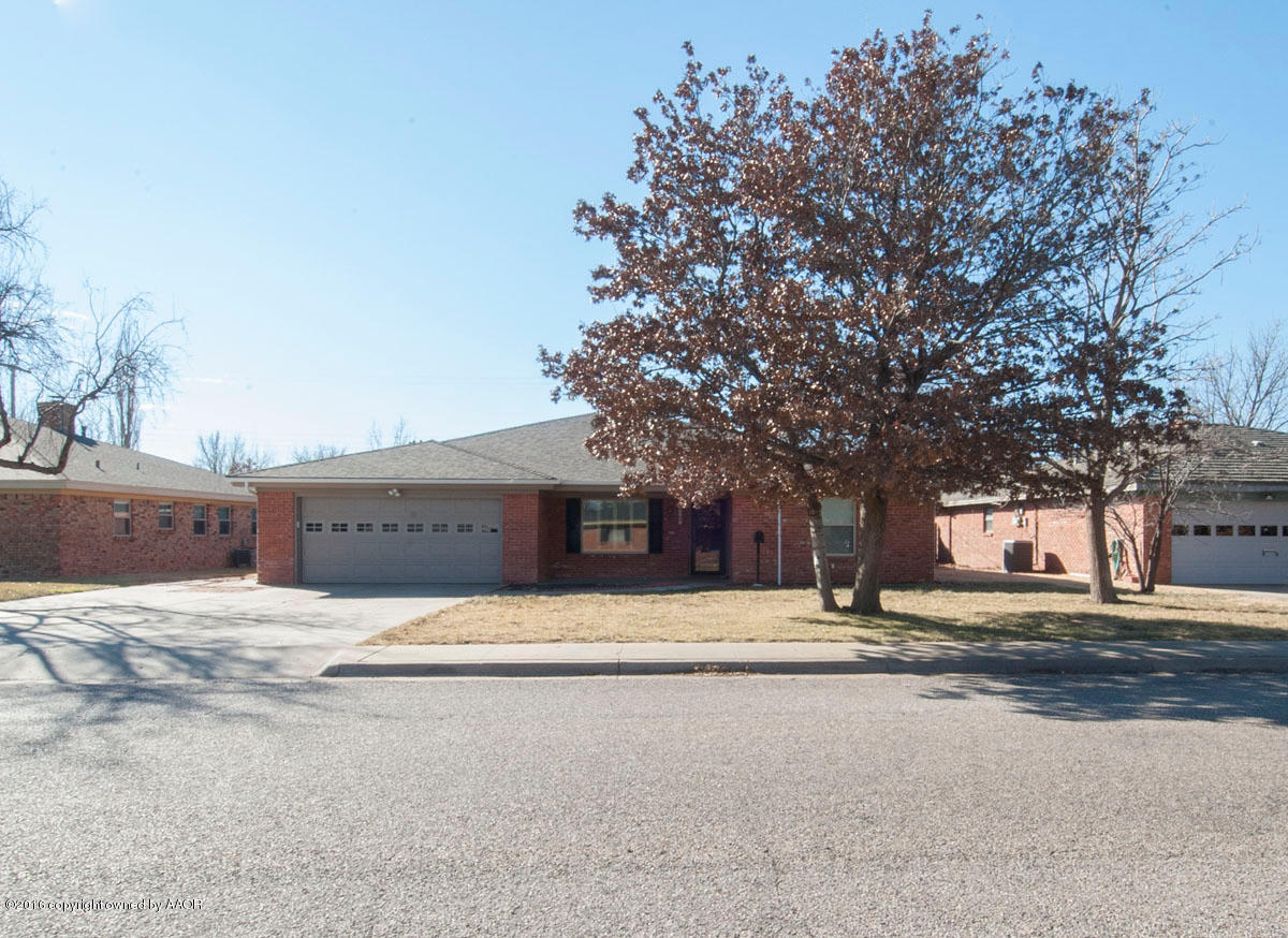 7203 Dreyfuss Road Amarillo, TX 79106 - Photo 2 of 22 front view of a building with a tree
