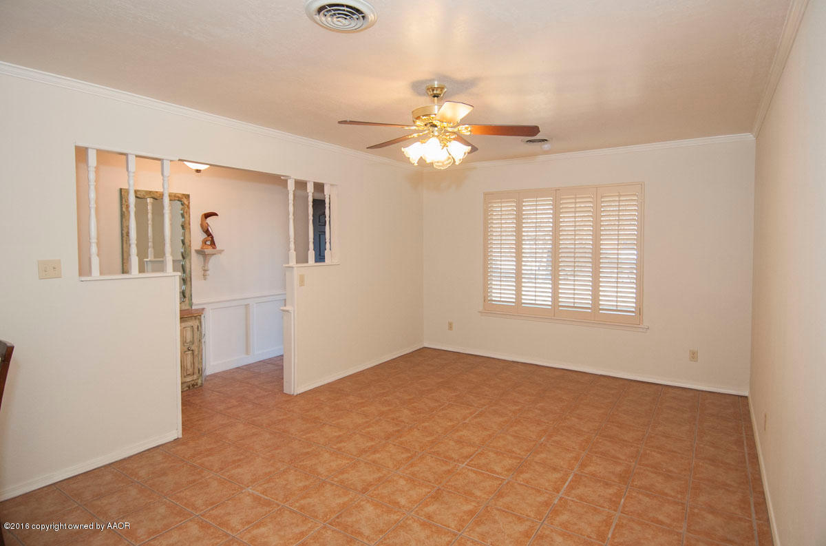 7203 Dreyfuss Road Amarillo, TX 79106 - Photo 10 of 22 an empty room with windows and fan