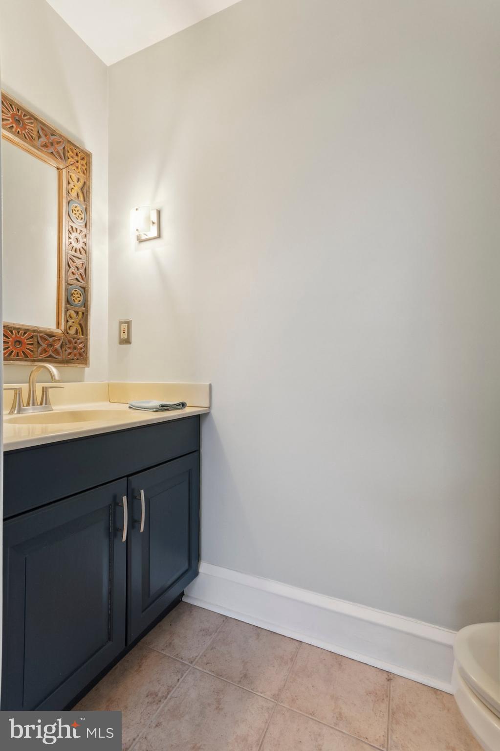 1420 Lawndale Road Havertown, PA 19083 - Photo 7 of 15 a bathroom with a sink and a mirror