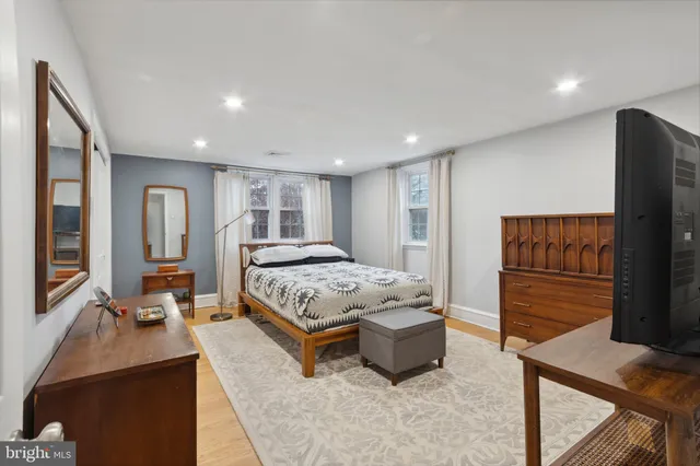 a bedroom with a bed and a dresser